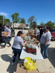 Volunteers distributing food to cars